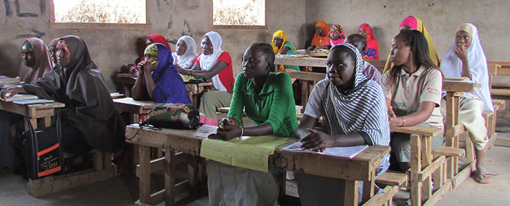 Girls attending class in refugee camp